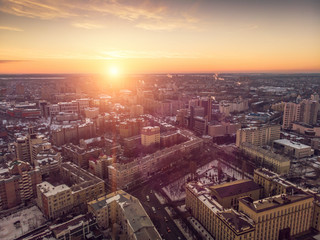 Naklejka na ściany i meble Aerial view of winter midtown of Voronezh city with buildings, roads and skyline at sunset