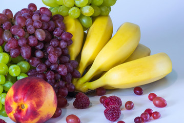 Still life with juicy, appetizing, bright fruits on a light background