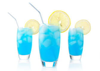 Blue lagoon drinks with slice of lemon with straw isolated on white