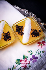 yellow pudding with coconut decoration