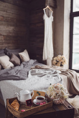 Fototapeta na wymiar Wedding decor of bedroom with wedding accessories. Bride's morning and preparation