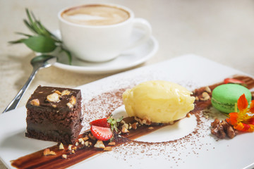 Elegant dessert in the plate served with a cup of coffee