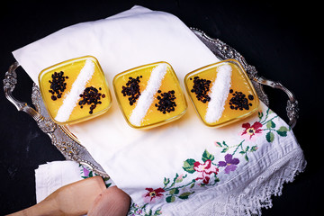 yellow pudding with coconut decoration