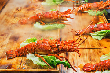 Cooked lobster on the wooden table.