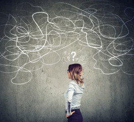 Confused business woman solving a problem