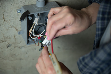Female Electriction Fixing an outlet