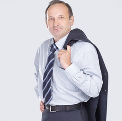 confident businessman holding a jacket over his shoulder