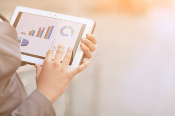 close up. business woman checks financial report using digital tablet