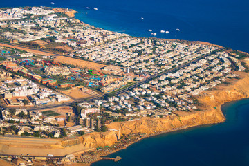 Egypt with flight height, hotel building and red sea