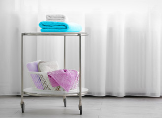 Cart with clean towels indoors
