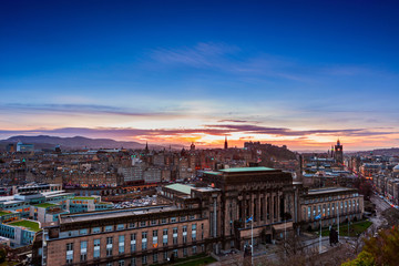 Naklejka na ściany i meble Picturesque view over evening Edinburgh old town with the Castle from Calton hill, Scotland