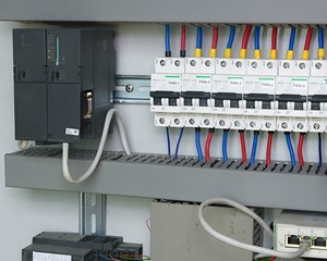 Image shows control cubicle. Electric device and circuit breakers inside power case