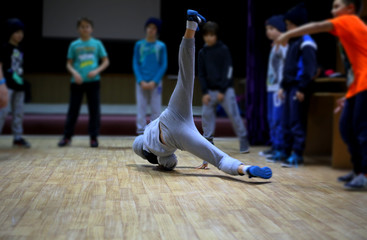 dancer in action,dance battle, break dance dancer in a unique figure