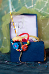 Accessories for needlework in a blue box