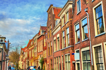 Traditional dutch houses on a street of Leiden, Holland