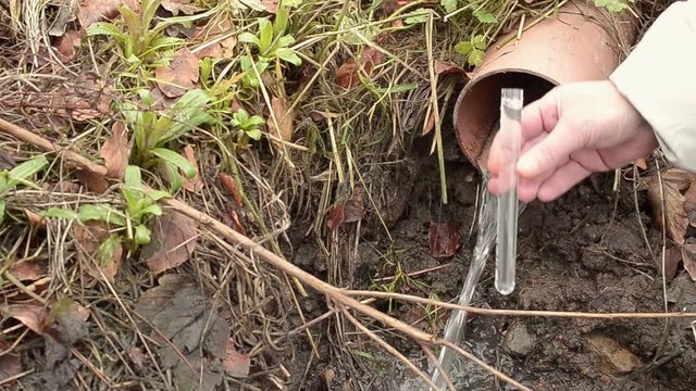 Collecting drain pipe water sample with test tube