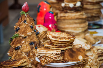 A variety of original pancakes in the contest during the celebration Russian Shrovetide (pancake week) at school