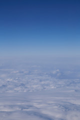 Fototapeta premium Beautiful Above clouds from an airplane