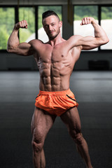 Bodybuilder Performing Double Biceps Pose