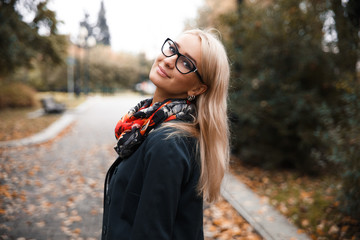 Beautiful blonde in autumn with glasses