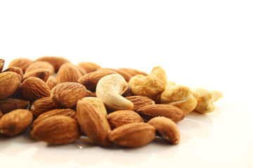 Almond and cashew nut on white background