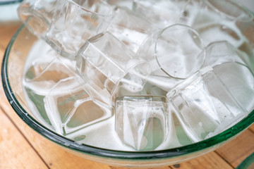 a lot of a glass of water glass in the glass sink ready for washing and clean.