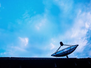 satellite dish on background of blue sky
