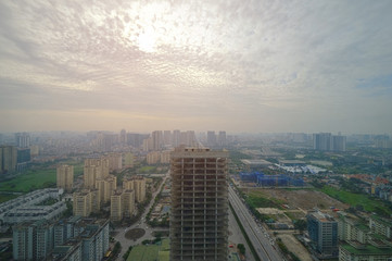 Fototapeta na wymiar Aerial skyline view of cityscape in Hanoi, Vietnam, on cloudy sky day