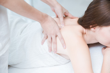 Fototapeta na wymiar women back pain massage in spa