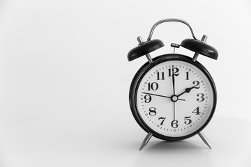 retro clock at 2 o'clock on white background space for text.