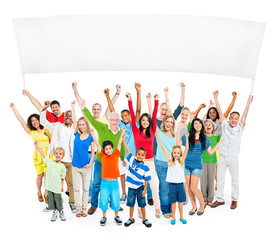 Fototapeta premium Multi-Ethnic Group Of Casual People With Children Raising Their Arms As They Hold Empty Banner For A Copy Space.