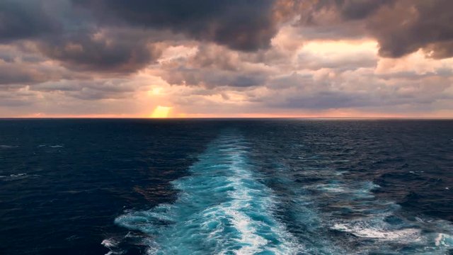 Beautiful calm ocean view from cruise ship during sunset