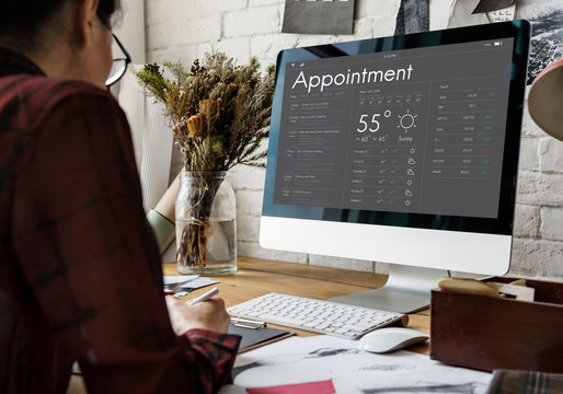 Woman checking appointment on personal organizer schedule