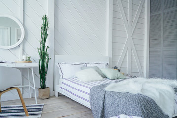 Scandinavian modern cozy eco interior, white table and mirror in bed room, minimalism