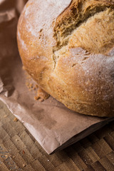Brown bread close up still on a brown background