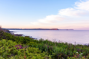 Vibrant colours of Cornish coast at dusk, Portscatho, Roseland Peninsula, Cornwall, England