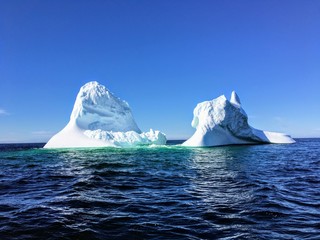 A massive iceberg floating off the coast of Twilingate, Newfoundland and Labrador, Canada.  The...