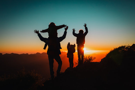 Happy Father With Kids Travel In Sunset Mountains, Family Hiking In Nature