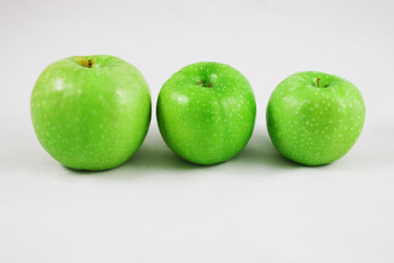 Three green apples isolated on whte 