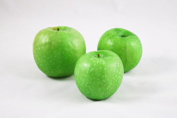 Three green apples isolated on whte 