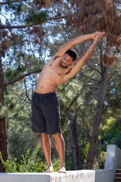 Male Yoga Instructor in Standing Side Bend Pose