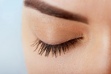 Eyelash Care Treatment Procedures: Staining; Curling; Laminating and Extension for Lashes. Beauty Model with Perfect Fresh Skin and Long Eyelashes. Skincare; Spa and Wellness. Close up.Cosmetics