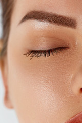 Eyelash Care Treatment Procedures: Staining; Curling; Laminating and Extension for Lashes. Beauty Model with Perfect Fresh Skin and Long Eyelashes. Skincare; Spa and Wellness. 