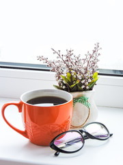 Coffee mug with letter and glasses on teal rustic table,cozy breakfast, vintage style. Breakfast coffee.cozy breakfast, vintage style. Office workers having a coffee break. top view. Having a break.