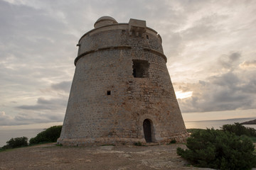 Fototapeta premium The tower of Sa Sal Rossa at dawn