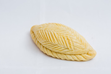 Isolated and macro shot of Novruz holiday cookie shekerbura on white background