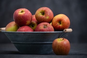 delicious red apples in old metal washtub