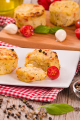 Potato gratins with mozzarella and tomatoes.
