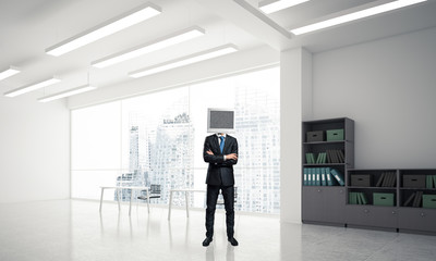 Businessman with monitor instead of head.