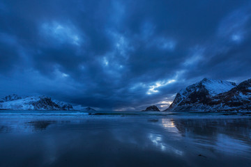 landscape with mountains and clouds in sunset at the beach, Lofoten, Norway